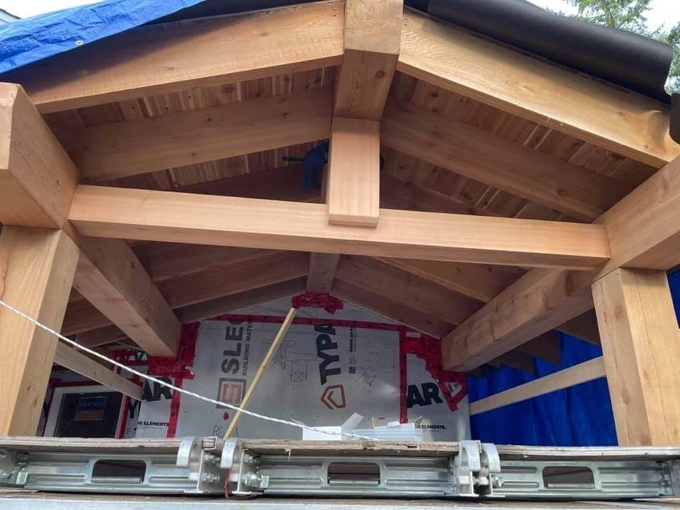Wooden roof framing beams construction overhead
