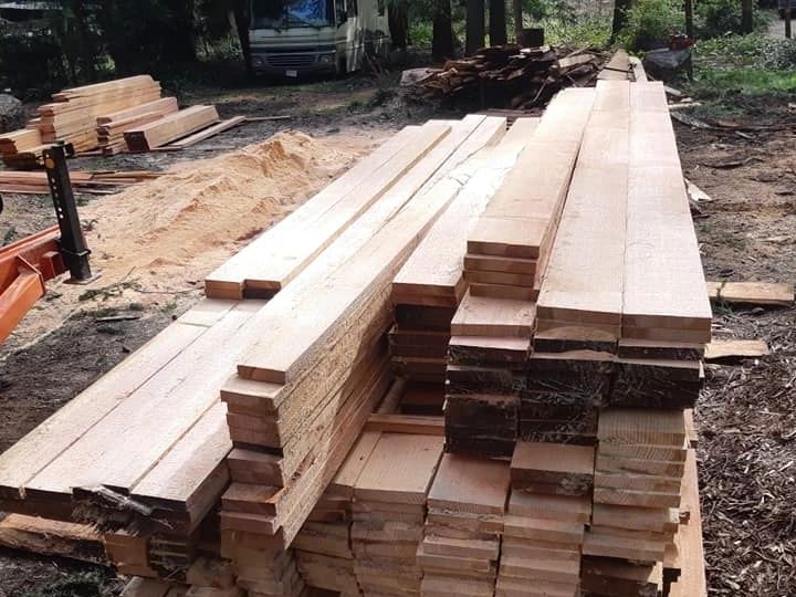 Freshly cut lumber planks stacked outdoor